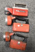 Three vintage red bodied torches