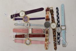 Ten bright coloured ladies fashion watches.