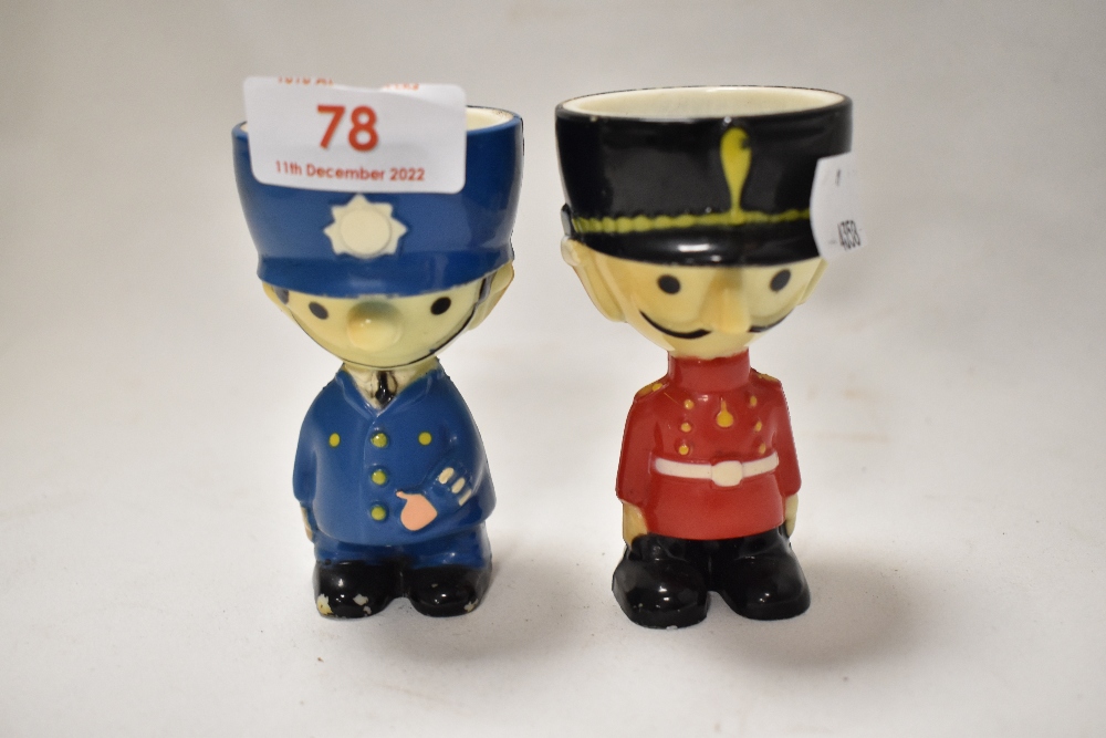 A pair of mid century cartoon style egg cups