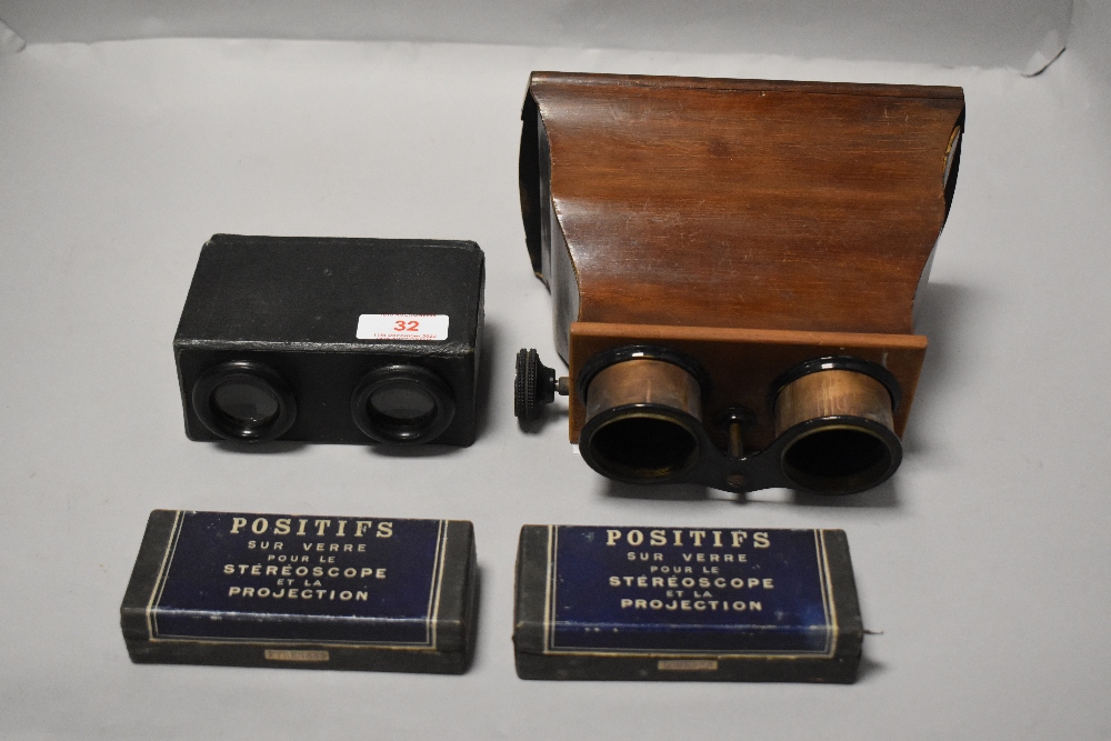 A pair of early 20th century stereoscopes with mahogany case and brass eye pieces, and a similar