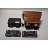 A pair of early 20th century stereoscopes with mahogany case and brass eye pieces, and a similar