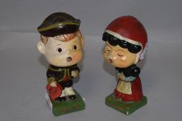 A pair of mid century bobble head figures with magnetic kissing lips AF
