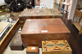 Five antique treen boxes, including 19th century money boxes and ex writing slope AF.