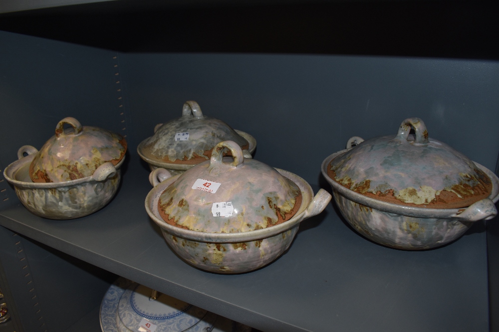 Four studio pottery tureens having naturalistic drip glazes, unsure of the maker but marked R. All