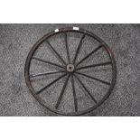 An early 20th century dog cart or similar wheel with cast rim band 56cm across