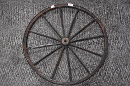 An early 20th century dog cart or similar wheel with cast rim band 56cm across