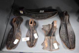 Five early 20th century cobblers shoe last two marked for SEGS and three for Blakey's