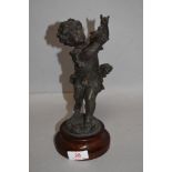 A Victorian French spelter figure of a boy chasing a bird 24cm tall AF