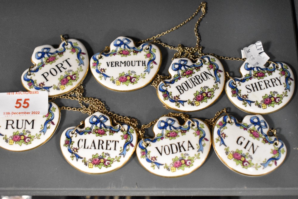 A set of eight Crown Staffordshire alcohol drinks labels