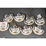 A set of eight Crown Staffordshire alcohol drinks labels