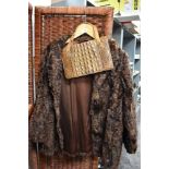 A vintage ladies Violet Tucker Astrakhan short length jacket with a crocodile skin handbag
