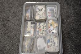 A box of GB & World Kiloware, all in individual plastic boxes, many thousand stamps