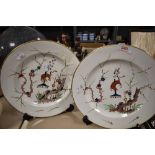 Two early 19th century plates, marked for Derby, having animals depicted to centres with foliate