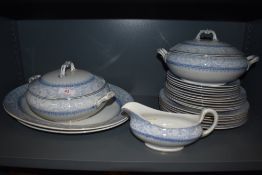 An early 20th century Cameo pattern part dinner service including two tureens, two chargers, gravy