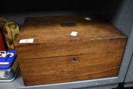 An Edwardian writers slope box, having fitted interior with a mahogany case. Case being worn and