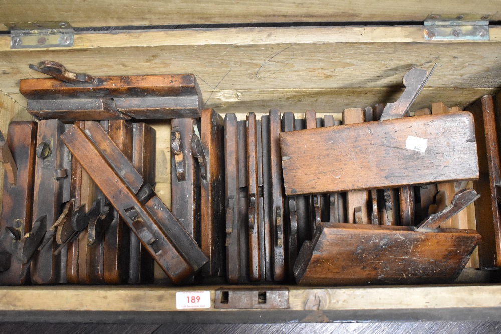 A joiners stained pine tool box, containing numerous moulding planes, mostly bearing name stamp - Image 2 of 2