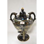 A Victorian samovar having ceramic body with Aesthetic floral design