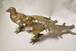 A pair of Victorian metal cast pheasant studies having a gilt finnish