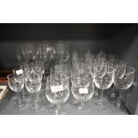 A large set of mid century clear glasses including wine, brandy, cordial, water and whisky