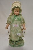 A Victorian German Gebruder Heubach bisque figure of a girl with skipping rope,approx 32cm.