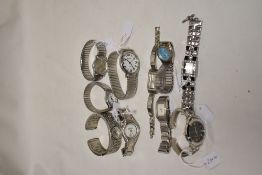 Ten girls/ladies fashion watches, all having white straps.