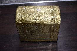 A mid century coal bucket in the form of a brass treasure chest