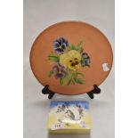 A Sandland ware Kookaburra design trinket case and a hand decorated terracotta plate