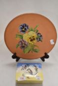 A Sandland ware Kookaburra design trinket case and a hand decorated terracotta plate