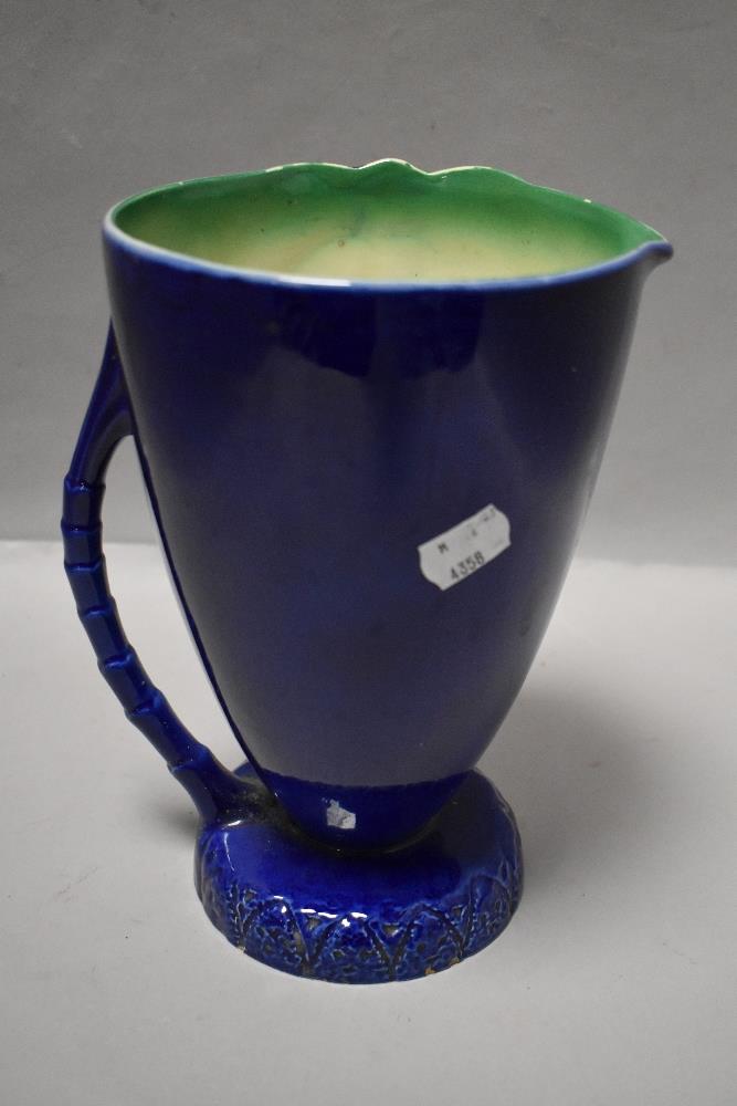 A Beswick 1028 vintage pitcher or water jug with Palm tree and deep blue glaze design 23cm tall - Image 2 of 4