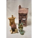 A small collection of studio pottery items, comprising a model house, dog kennel, fireplace and