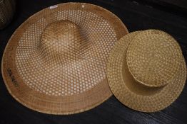 Two woven straw hats, Straw Boater type and wide brimmed.