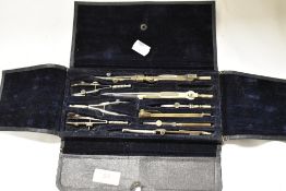 An early 20th century geometry set in fitted case, appears complete.