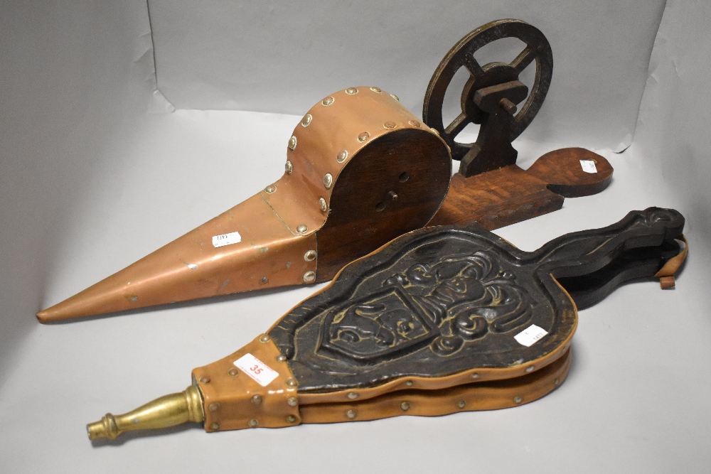 Two pairs of bellows one of Westmorland design and a pair of leather and carved oak in traditional