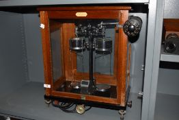 A John. E. Harcourt set of scientific balance scales in fitted glass and mahogany case.