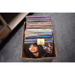 A box of around one hundred mixed vinyl LP records, Meat Loaf, The Rolling Stones, Elton John and
