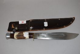 A hunter knife having leather sheath with bone handle 34cm long