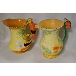 Two Art Deco water jugs including Burleigh ware Parrot handle having chips to rim and a Falcon