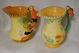 Two Art Deco water jugs including Burleigh ware Parrot handle having chips to rim and a Falcon