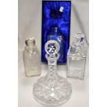 Four clear cut glass decanters including an Edinburgh Crystal glass etched with National Blood