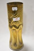 A military ammunition shell worked as Trench art with fluted base and bird design 29cm tall approx