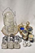 A silver-plated teapot stand, a chromed metal and glass pickle jar and a selection of condiment