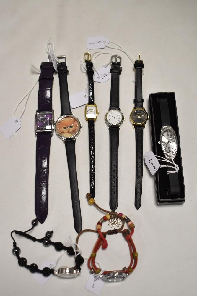 Ten ladies silver tone watches, one being a bracelet with coloured gems, also included are Sekonda