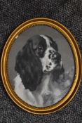 Reuben Ward Binks, (1880-1950), a gouache painting, spaniel, oval, signed, 29 x 24cm, beaded gilt