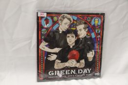 A gatefold copy in ex/ex of Green Day's ' Greatest Hits ' double album