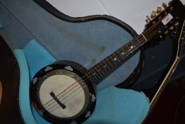 An early 20th Century banjo mandolin , J E Dallas maker, stamped 415 Strand, serial number 5685,