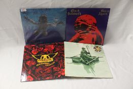 A four album lot with Sabbath and a classic title from Nirvana