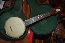 A vintage ukulele banjo, marked The Gibson to headstock, in large banjo case