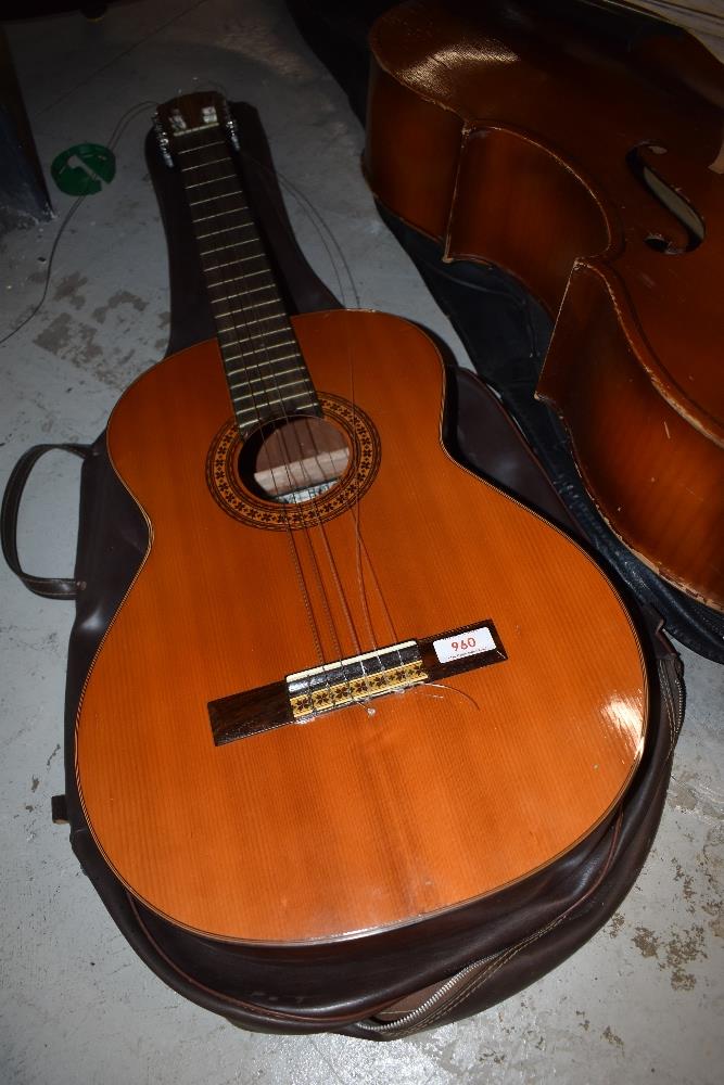 A modern classical guitar, Spanish style labelled Suzuki Japan