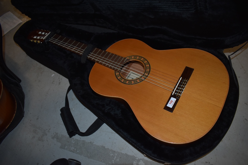 A modern Spanish classical guitar, labelled Almansa, in hard AAA case