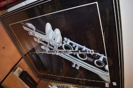 A frame print , musical Clarinet interest